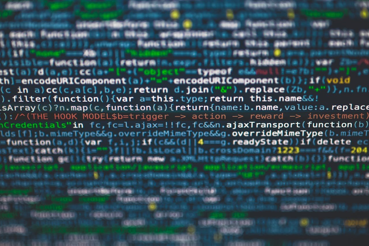 Contact Detailed view of colorful programming code on a computer screen.