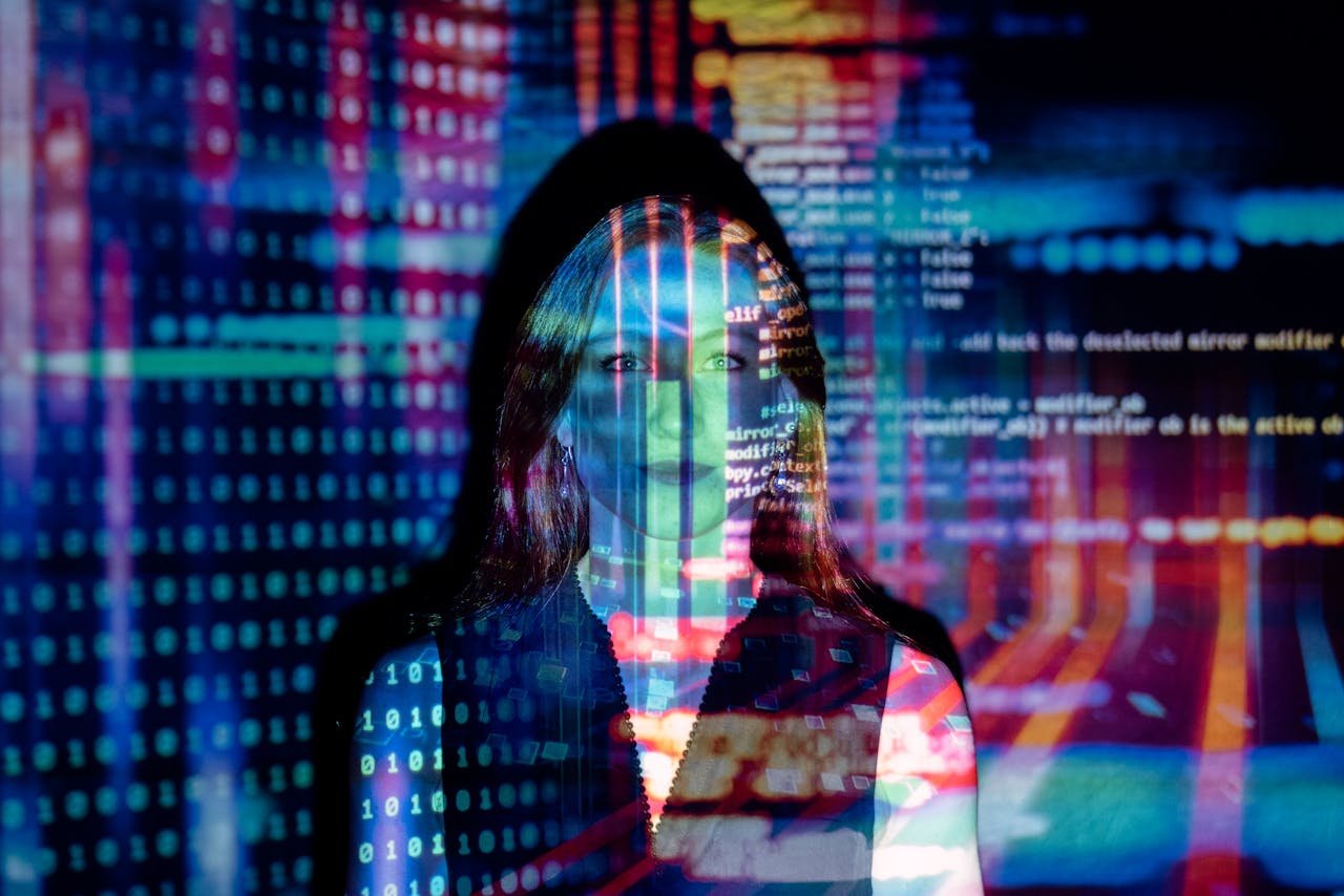 Services A woman with digital code projections on her face, representing technology and future concepts.